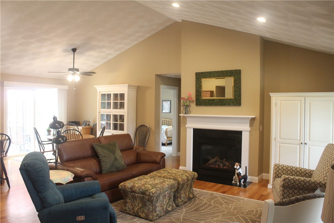 95 Roland Robinson Way North Kingstown, RI 02852 - Photo 2 of 19 Living room with cathedral ceilings and hardwood floors