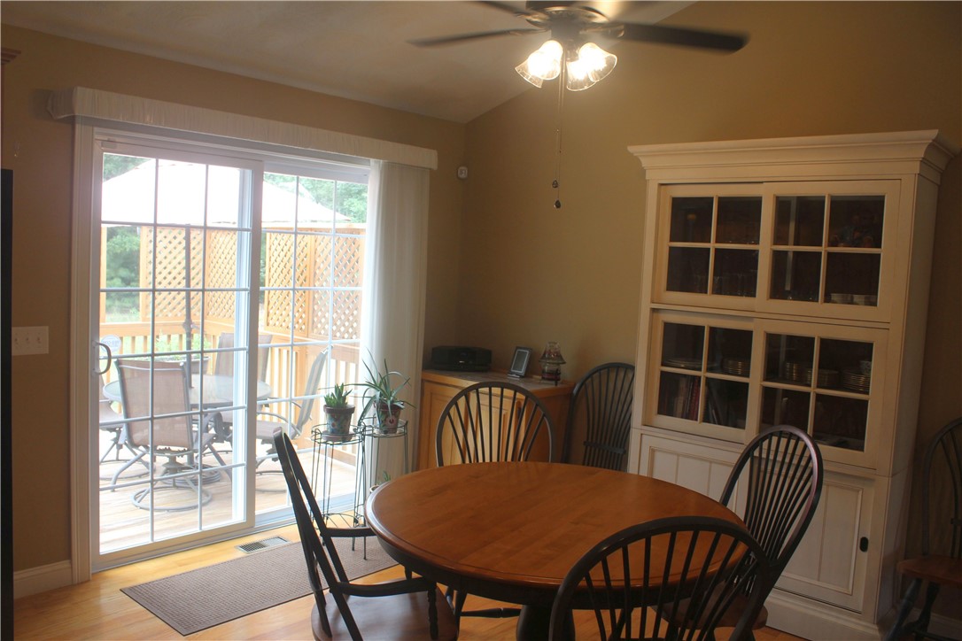 95 Roland Robinson Way North Kingstown, RI 02852 - Photo 5 of 19 Dining area with sliders to deck and hardwood floors