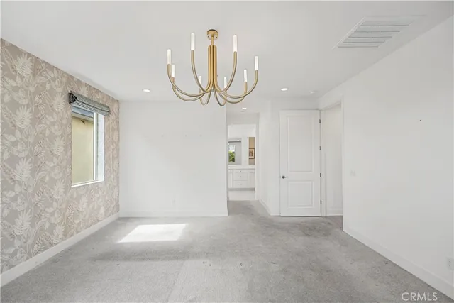 a view of a room with a cabinet and windows