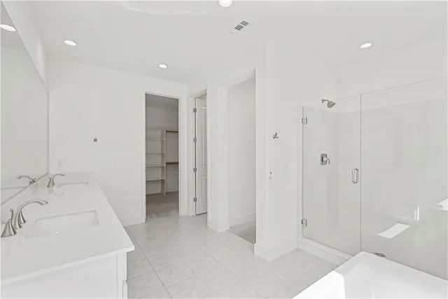 a bathroom with a sink and a shower