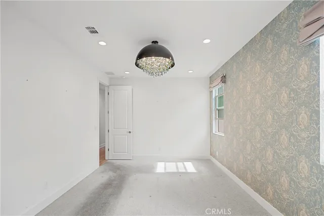a bathroom with a sink and a large mirror
