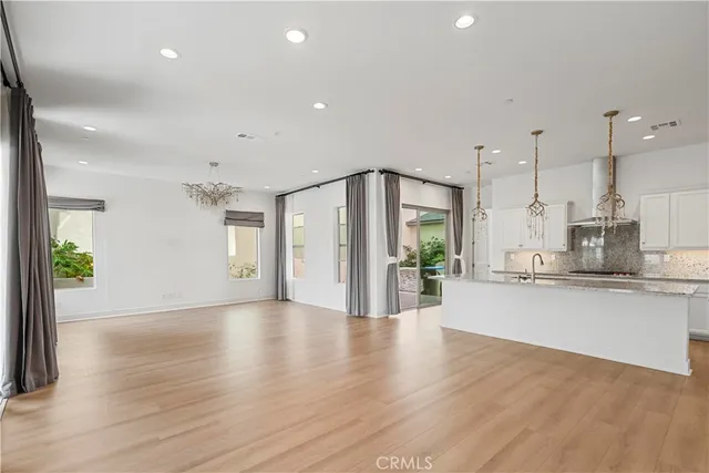 a view of a kitchen with a sink and a window