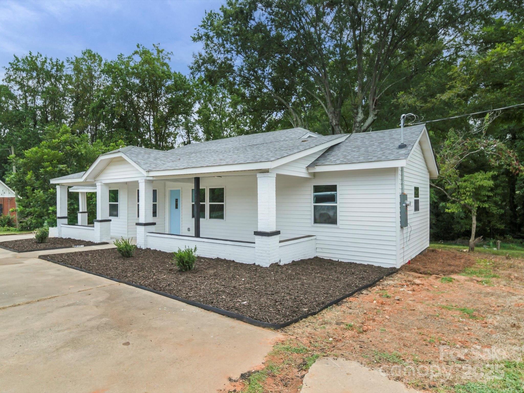 334 South Pink Street Cherryville, NC 28021 - Photo 2 of 25 a front view of a house with a garden