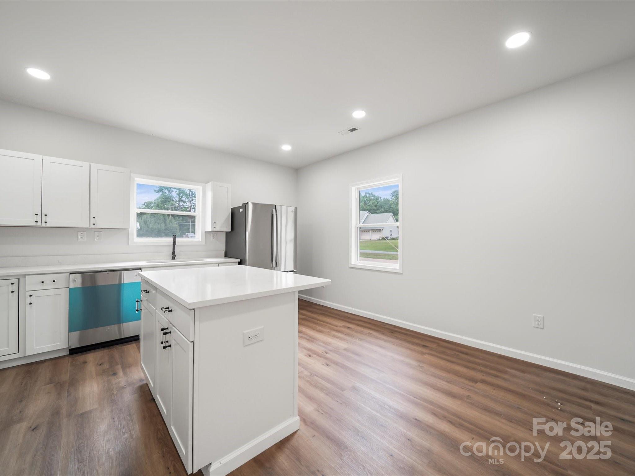334 South Pink Street Cherryville, NC 28021 - Photo 9 of 25 a kitchen with a sink stove and cabinets