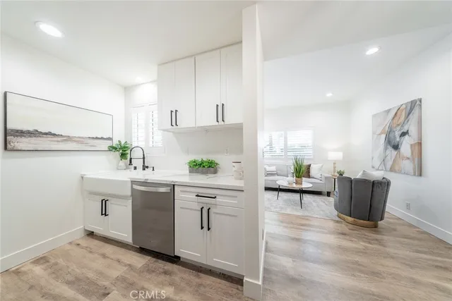 a kitchen with a refrigerator and a sink