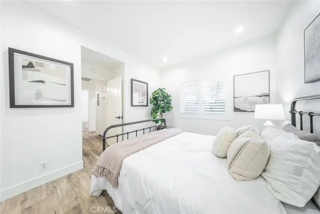 a bedroom with a bed and lamp