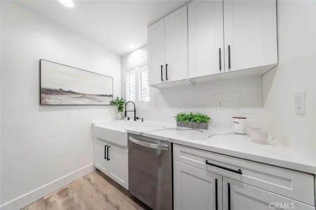 a kitchen with a sink and cabinets