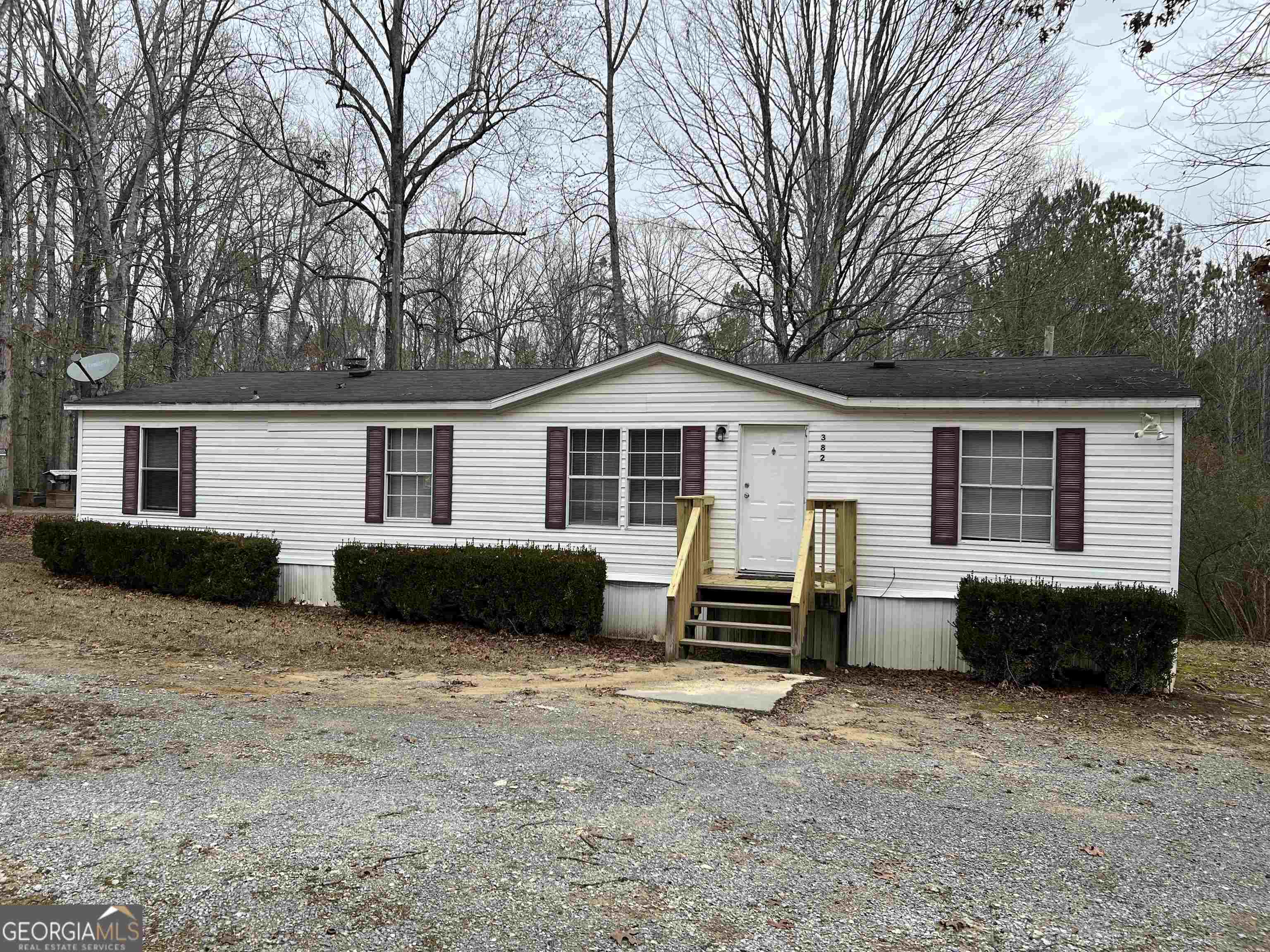 382 Cut Off Road Southwest Plainville, GA 30733 - Photo 1 of 1 a view of a house with a yard