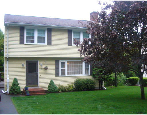 219 Florence Road Waltham, MA 02453 - Photo 1 of 1 a front view of a house with a yard and green space