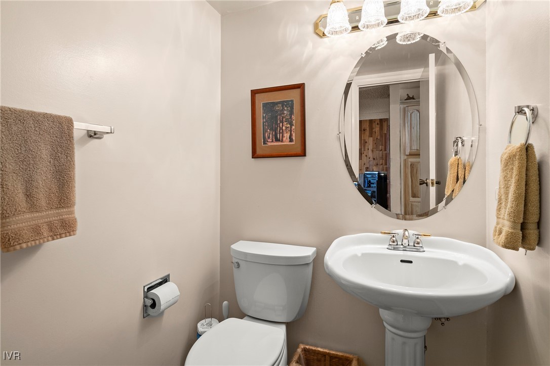 321 Ski Way, Unit 24 Incline Village, NV 89451 - Photo 9 of 31 a bathroom with a sink mirror and toilet