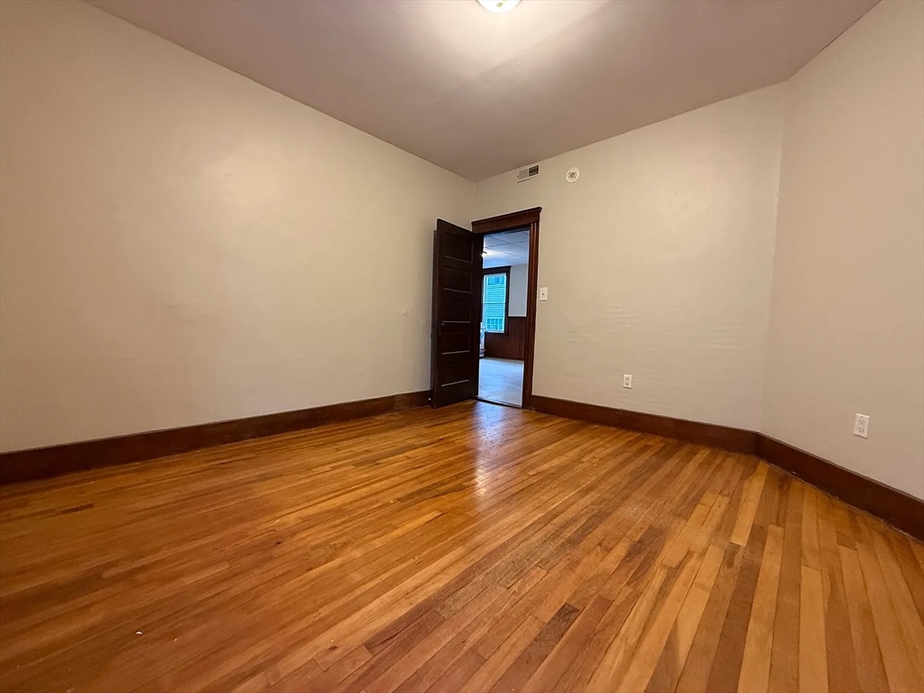 38 Ames Street, Unit 2 Worcester, MA 01610 - Photo 8 of 9 a view of an empty room with wooden and a window