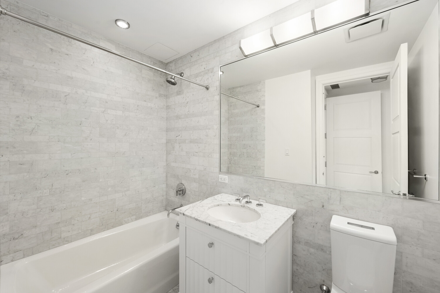 30 Park Place, Unit 61C Manhattan, NY 10007 - Photo 12 of 14 a bathroom with a sink a toilet and shower