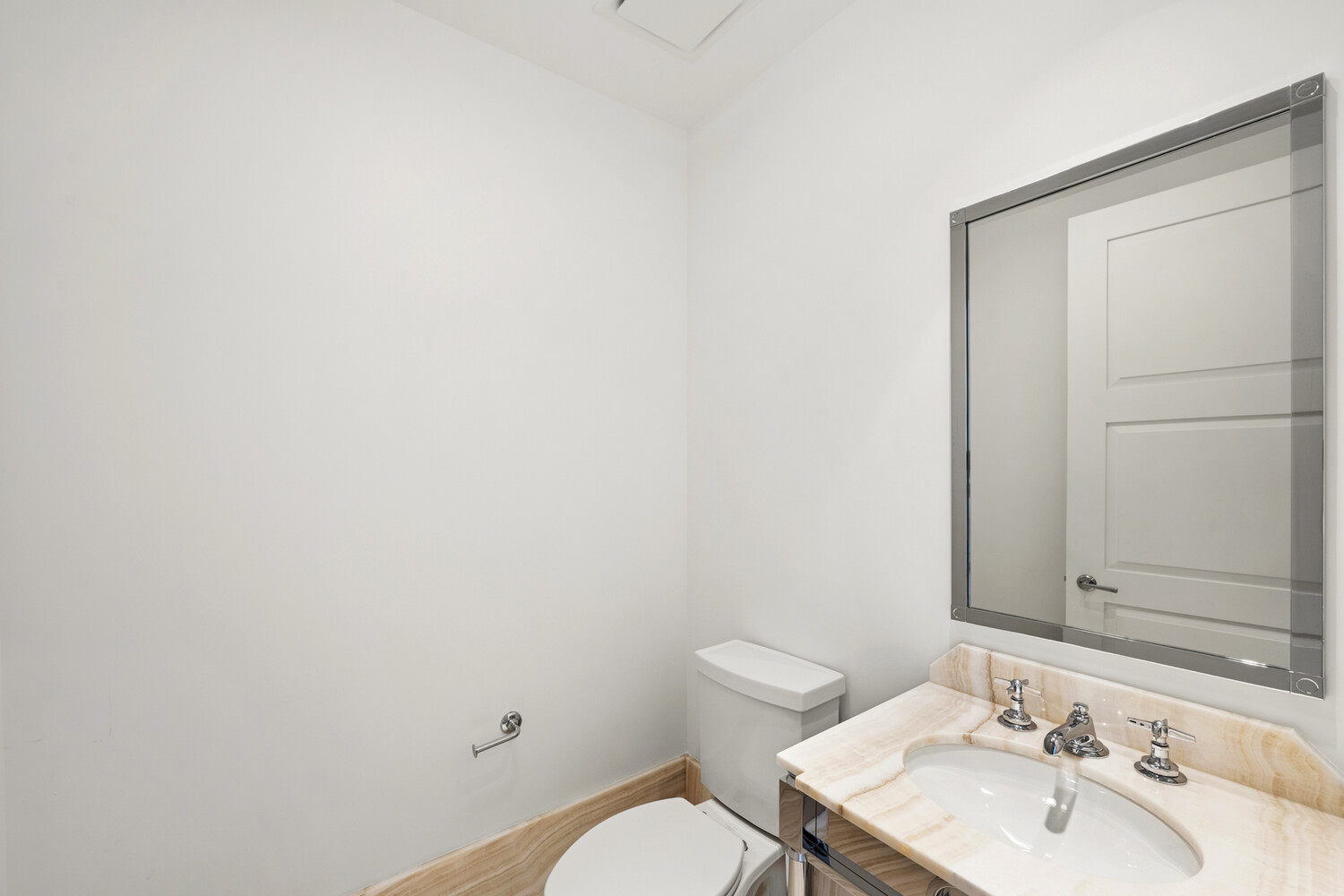 30 Park Place, Unit 61C Manhattan, NY 10007 - Photo 13 of 14 a bathroom with a sink a toilet and mirror