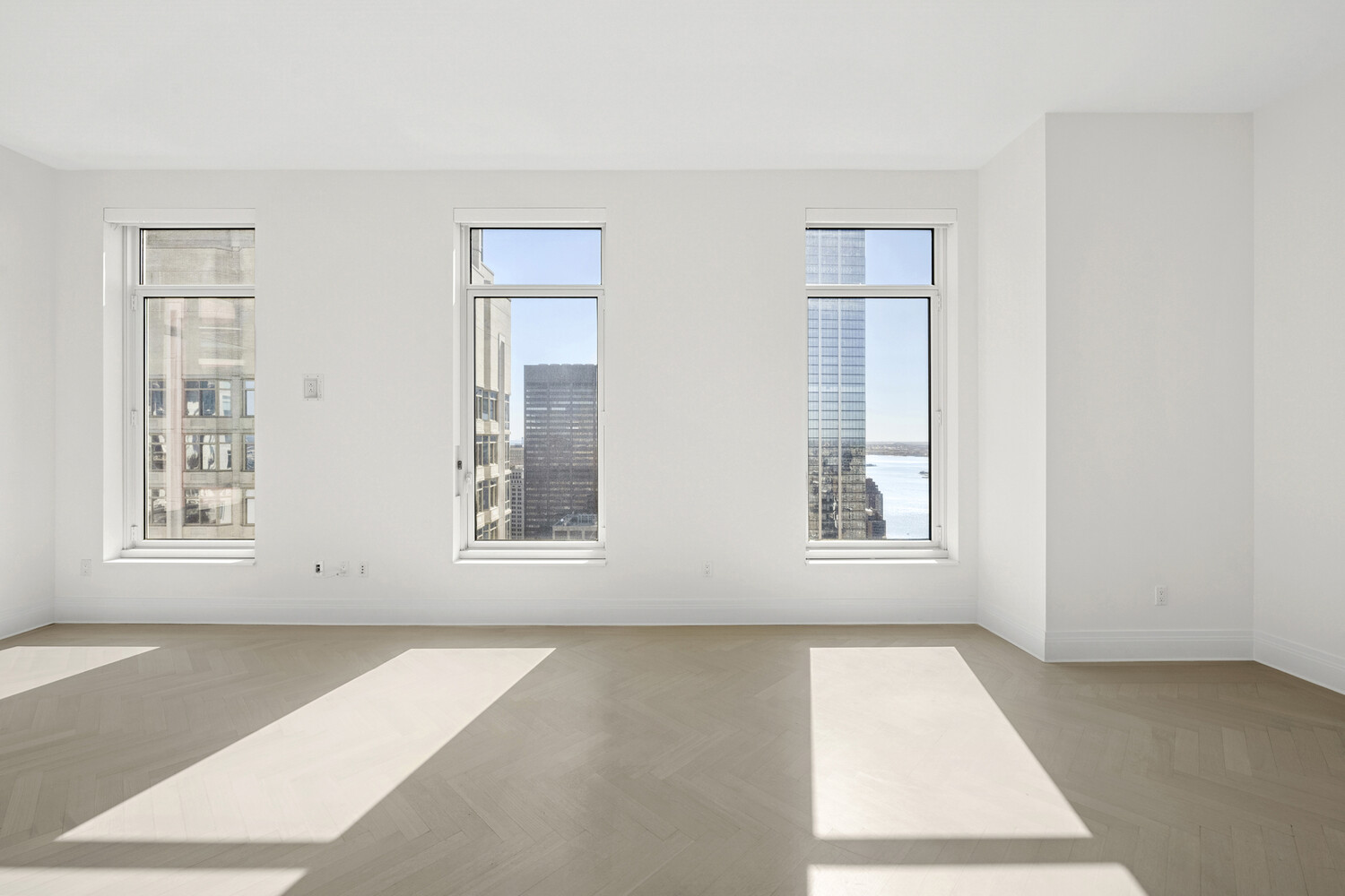 30 Park Place, Unit 61C Manhattan, NY 10007 - Photo 2 of 14 an empty room with windows