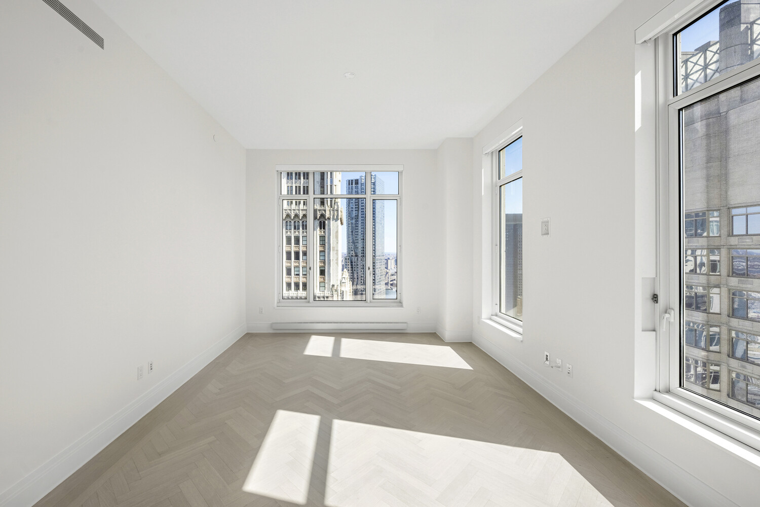 30 Park Place, Unit 61C Manhattan, NY 10007 - Photo 3 of 14 an empty room with windows