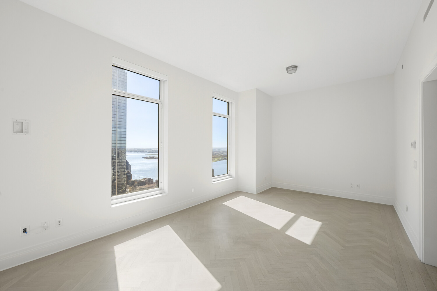 30 Park Place, Unit 61C Manhattan, NY 10007 - Photo 4 of 14 an empty room with windows