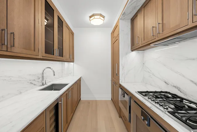 a bathroom with a sink a mirror and a bathtub