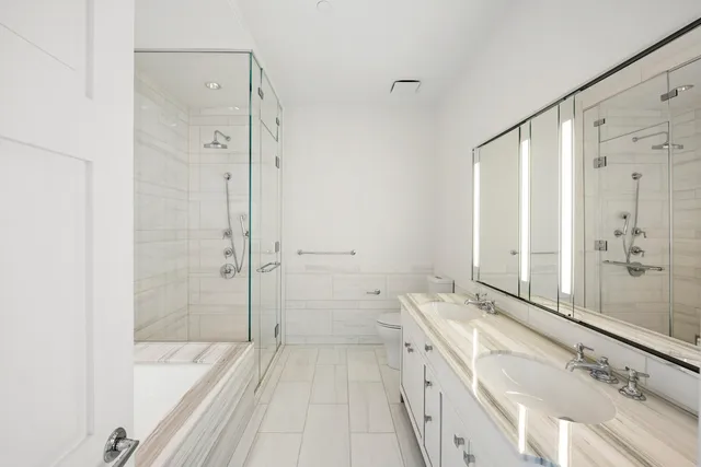 a kitchen with granite countertop a sink stove and cabinets