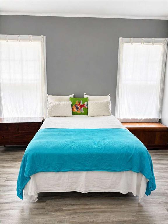 2405 Meriwether Road Shreveport, LA 71108 - Photo 11 of 20 a bedroom with a bed and a window