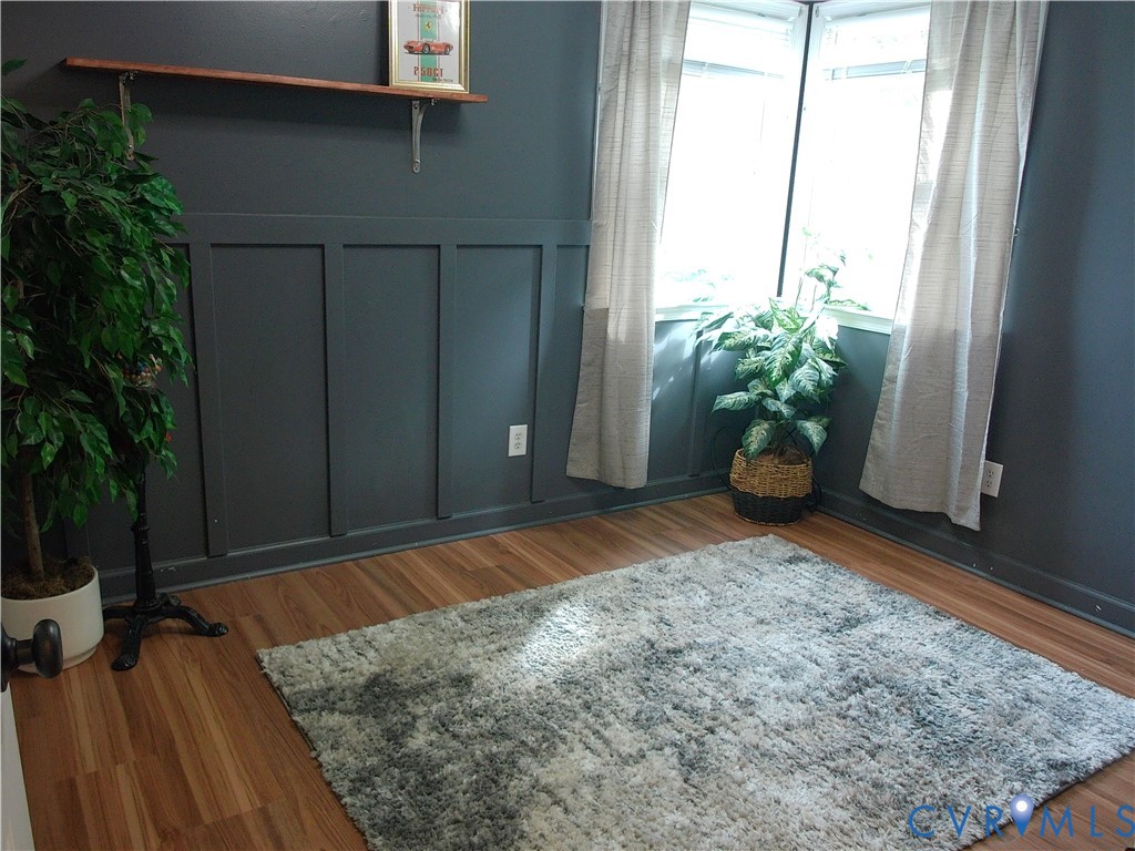 3284 Chickahominy Road Toano, VA 23168 - Photo 21 of 26 Wood-finish flooring, corner windows, and wainscot