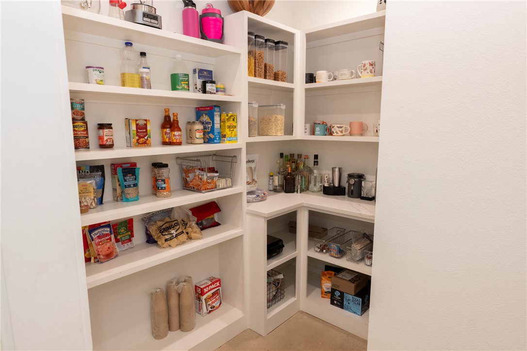 7105 Watermelon Road Somerville, TX 77879 - Photo 17 of 40 a room with a wooden floor shelf