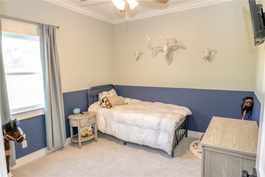 7105 Watermelon Road Somerville, TX 77879 - Photo 25 of 40 a bedroom with a bed and a window