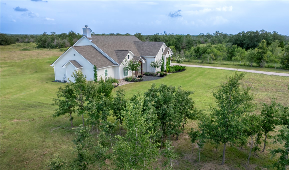 7105 Watermelon Road Somerville, TX 77879 - Photo 3 of 40 an aerial view of a house with a big yard