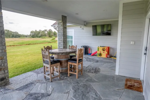 a bedroom with wooden floor and gym equipment