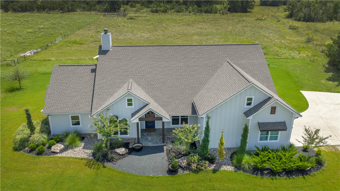 7105 Watermelon Road Somerville, TX 77879 - Photo 36 of 40 a front view of a house with garden