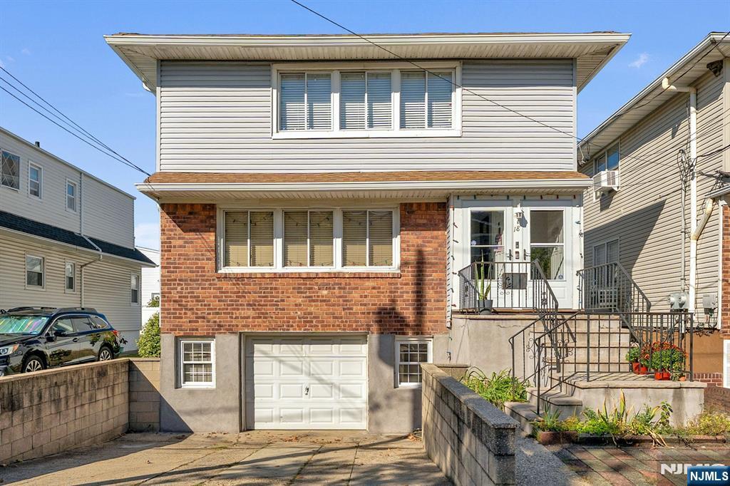 a front view of a house with many windows
