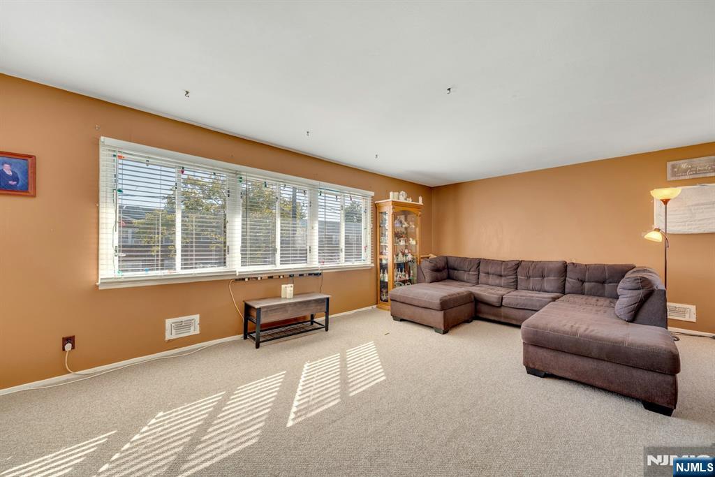 18 Ferncliff Road Jersey City, NJ 07305 - Photo 18 of 33 a living room with furniture and a large window