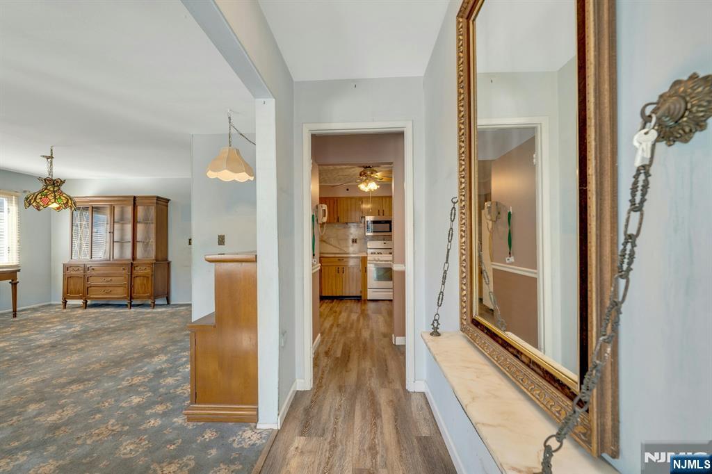 18 Ferncliff Road Jersey City, NJ 07305 - Photo 2 of 33 a view of a hallway with wooden floor and a living room