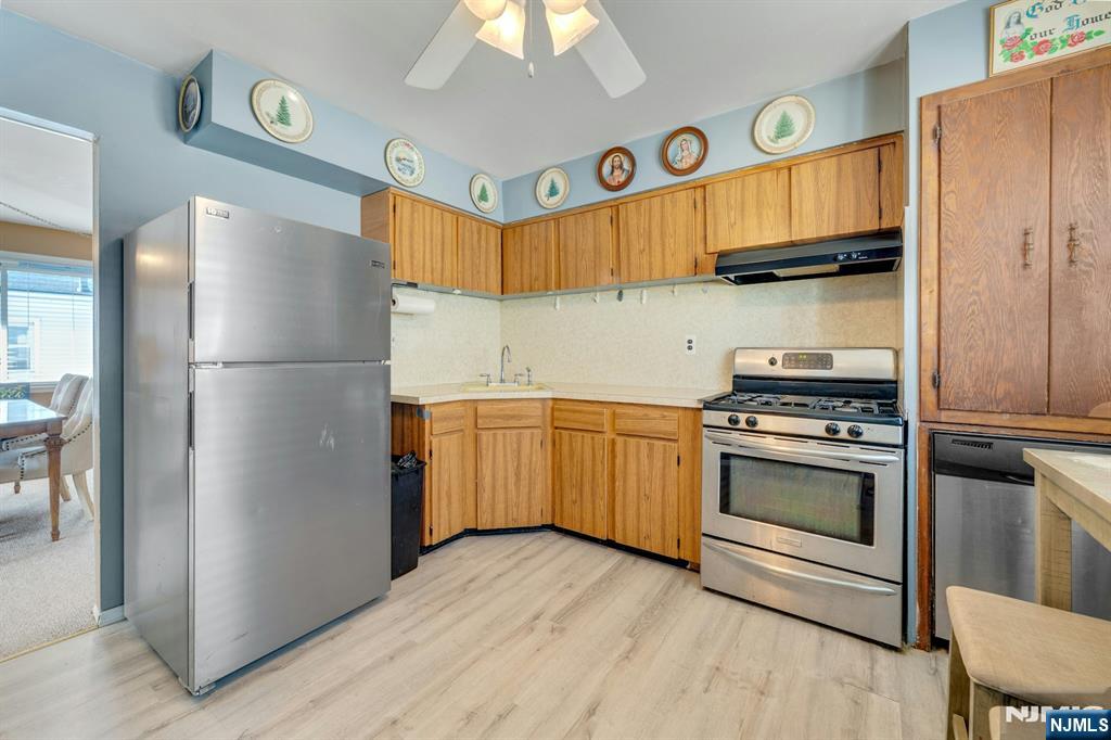 18 Ferncliff Road Jersey City, NJ 07305 - Photo 24 of 33 a kitchen with a refrigerator and a sink