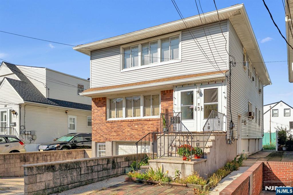 18 Ferncliff Road Jersey City, NJ 07305 - Photo 32 of 33 a front view of a house with street