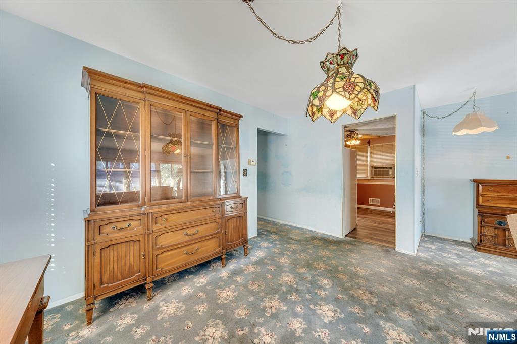 18 Ferncliff Road Jersey City, NJ 07305 - Photo 6 of 33 a view of a bedroom with windows and cabinet