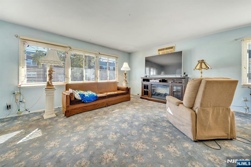 18 Ferncliff Road Jersey City, NJ 07305 - Photo 7 of 33 a living room with furniture and a flat screen tv