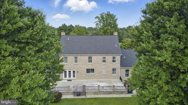 a view of a patio with a table and chairs
