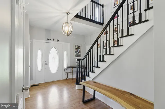 a view of entryway with wooden floor and door