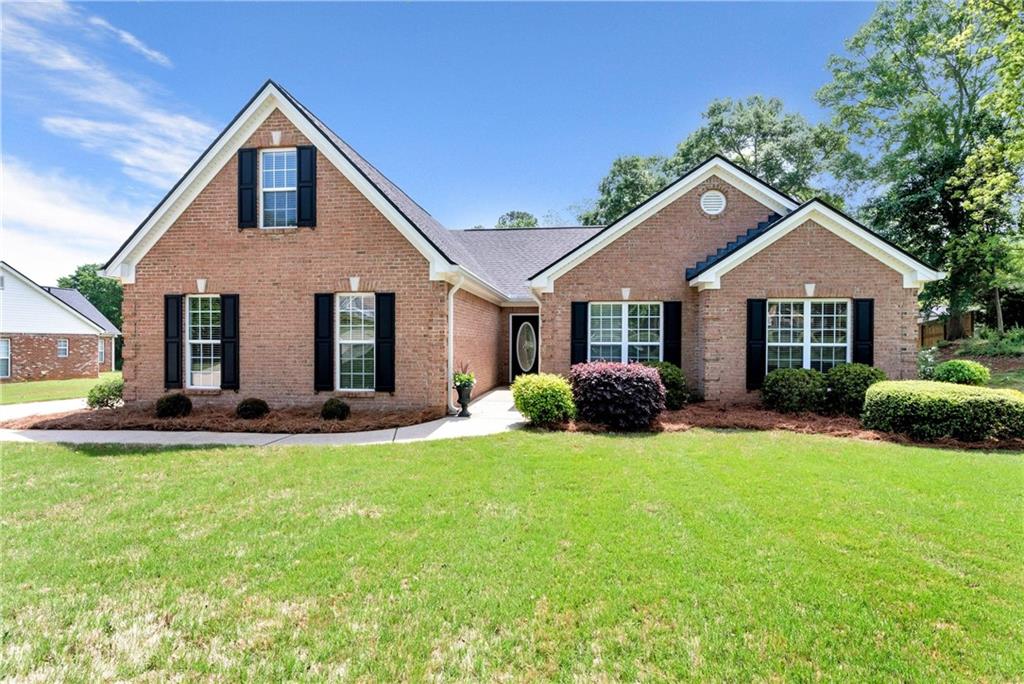 23 Stanton Way Winder, GA 30680 - Photo 1 of 1 a front view of a house with a yard