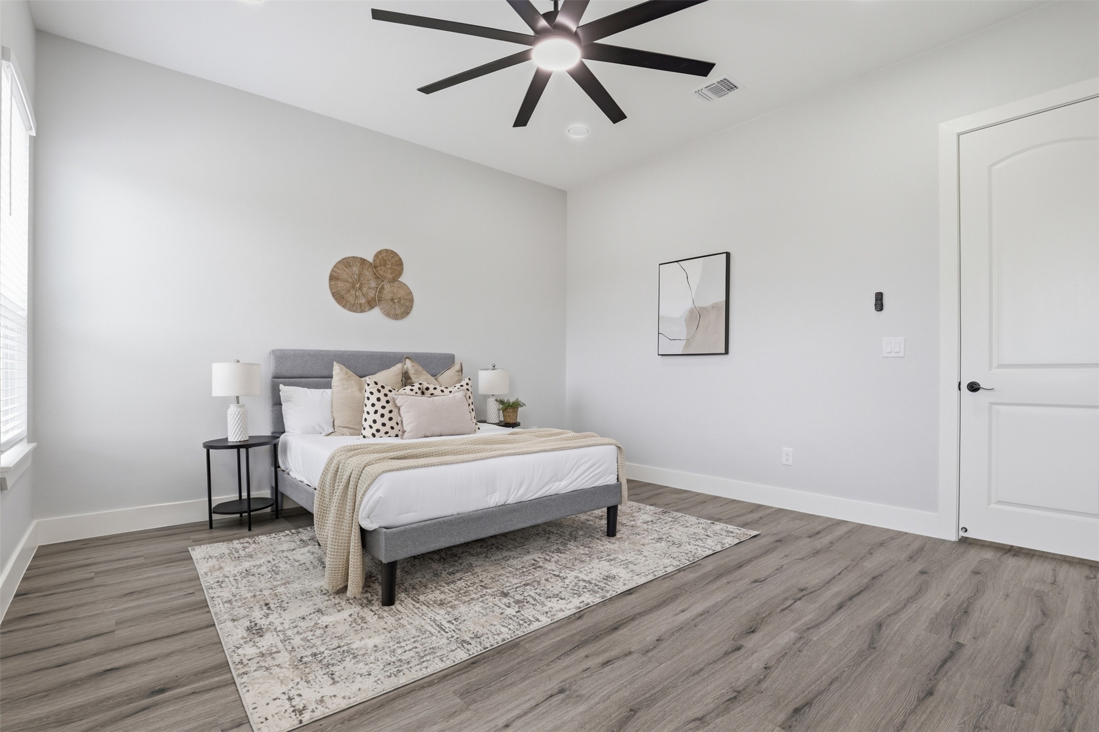 123 Los Robles Road Elgin, TX 78621 - Photo 11 of 21 Spacious room with high vaulted ceilings and wood-finish flooring