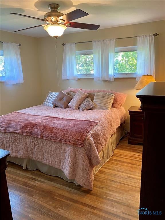 3929 Seaman Road Oregon, OH 43616 - Photo 27 of 50 2nd Bedroom w/ hardwood & ceiling fan.