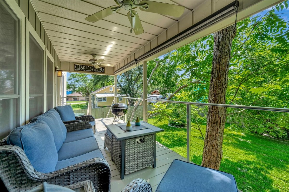 112 Oak Road Clear Lake Shores, TX 77565 - Photo 12 of 41 NICE SHADED BALCONY OFF THE DINING ROOM AND DEN IS A GREAT SPOT TO RELAX OR COOK.
