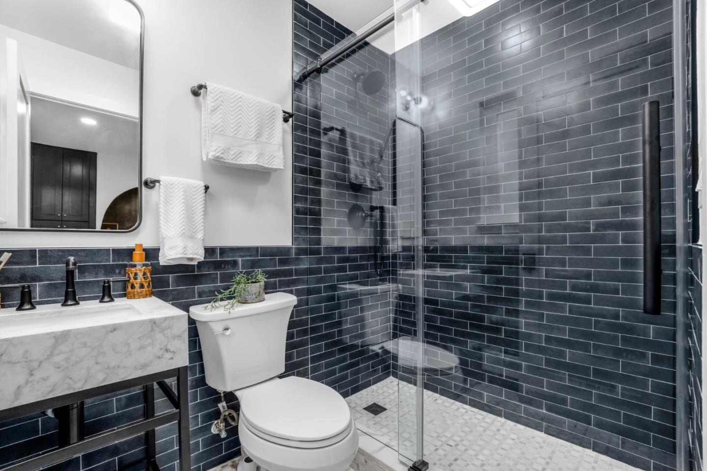 26645 Altamont Road Los Altos Hills, CA 94022 - Photo 19 of 60 a bathroom with a toilet a sink and mirror