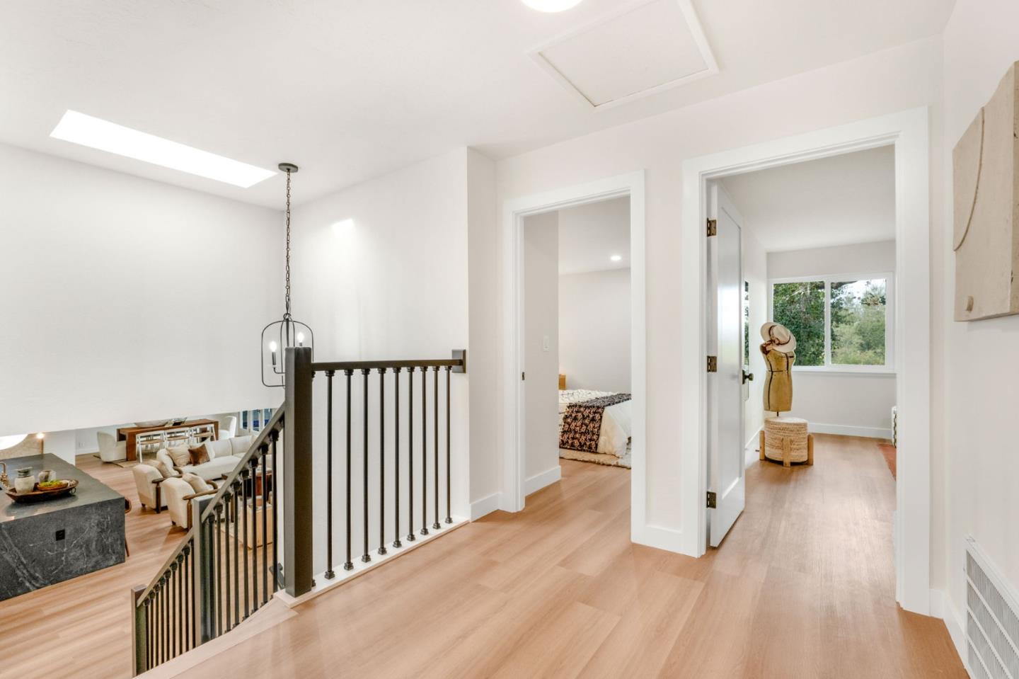 26645 Altamont Road Los Altos Hills, CA 94022 - Photo 22 of 60 a view of a hallway with a view of bedroom with wooden floor