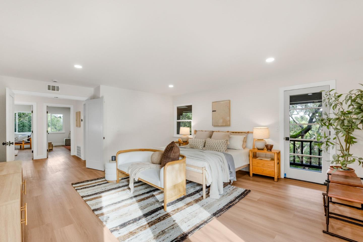 26645 Altamont Road Los Altos Hills, CA 94022 - Photo 24 of 60 a spacious bedroom with a bed and wooden floor