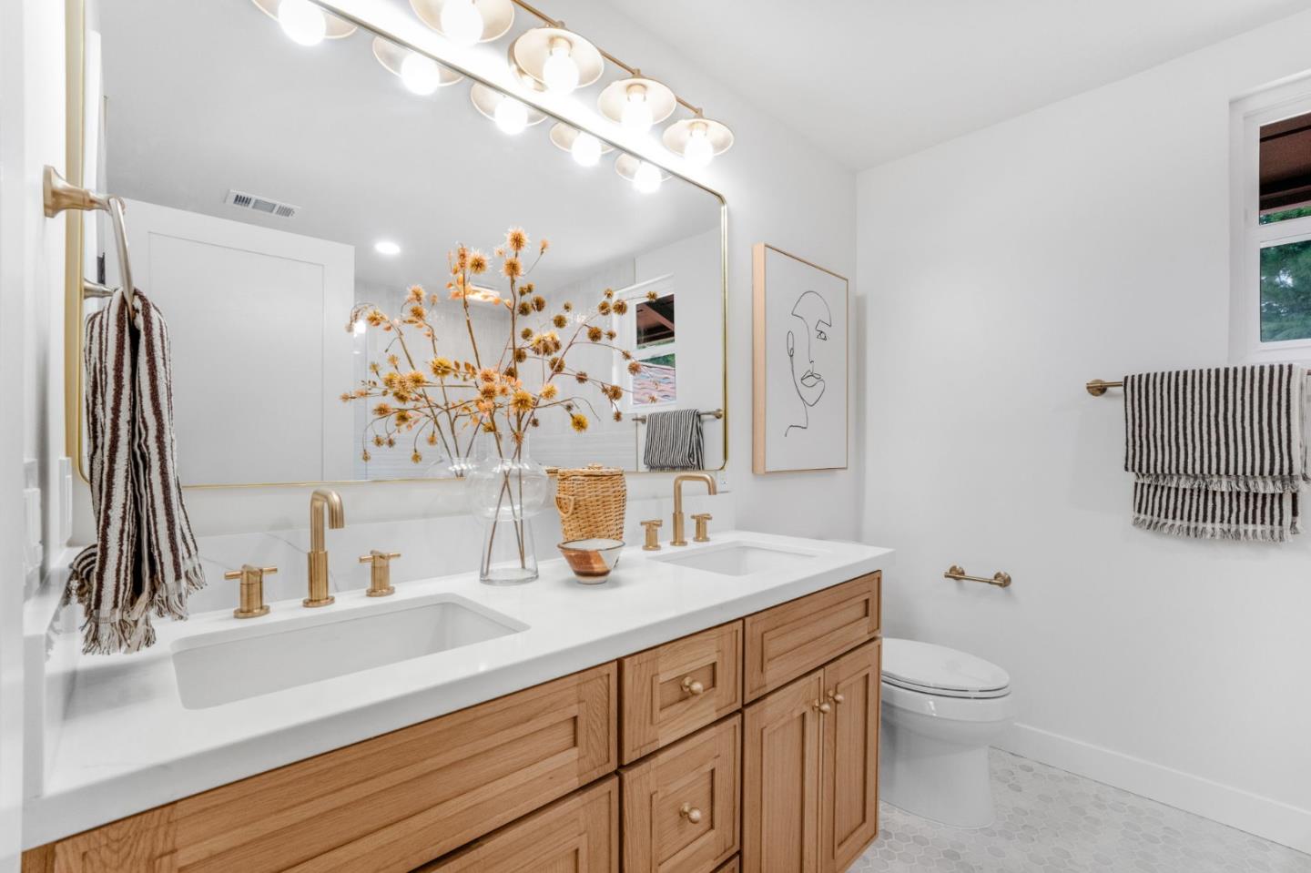 26645 Altamont Road Los Altos Hills, CA 94022 - Photo 25 of 60 a bathroom with a sink vanity granite and toilet