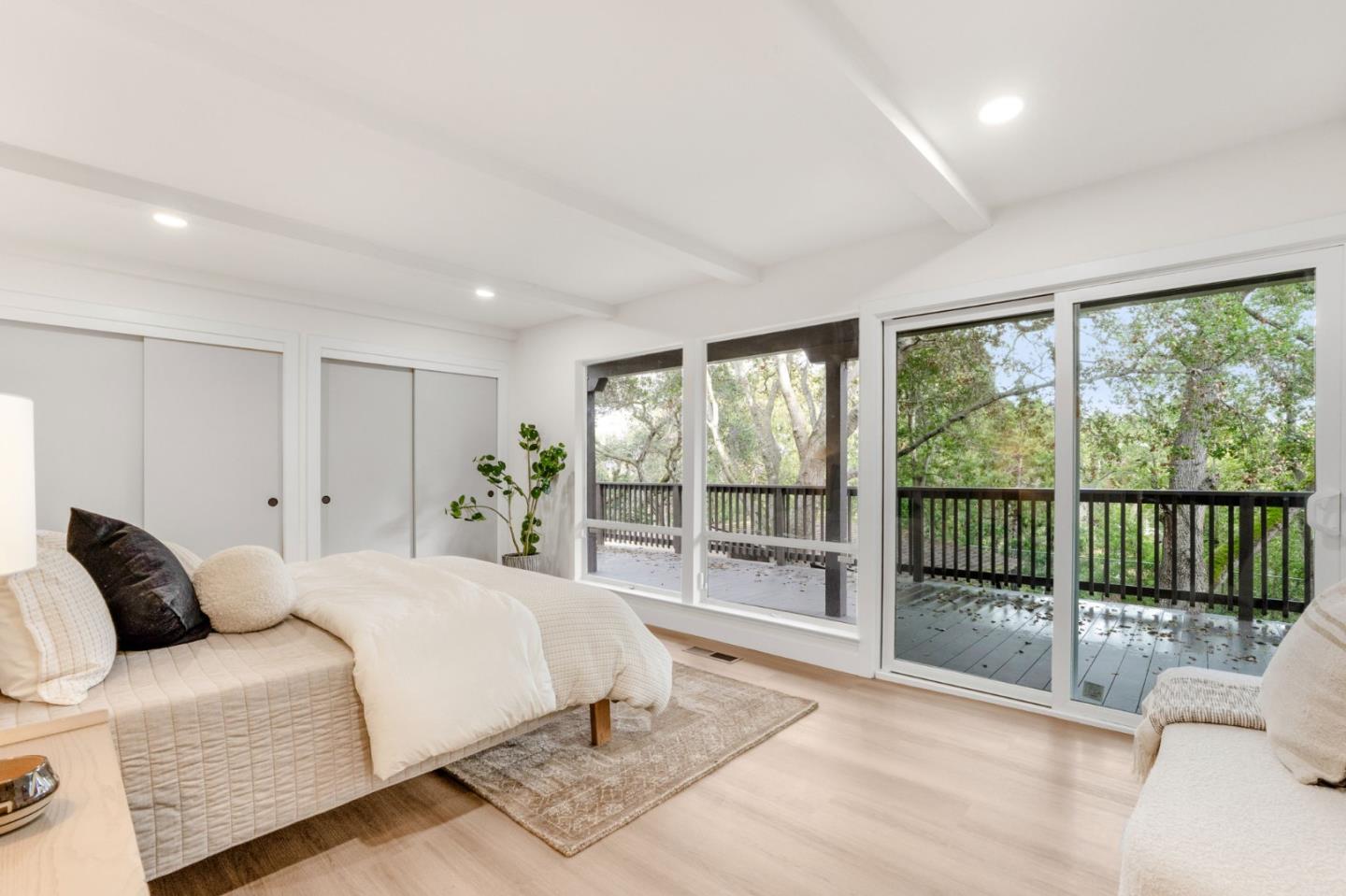 26645 Altamont Road Los Altos Hills, CA 94022 - Photo 32 of 60 a spacious bedroom with a bed and a large window