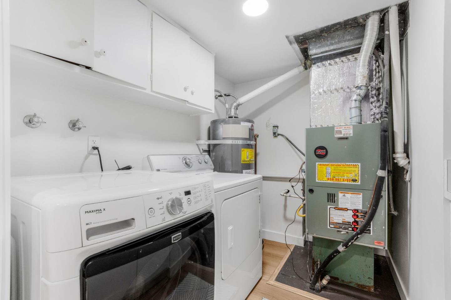 26645 Altamont Road Los Altos Hills, CA 94022 - Photo 40 of 60 a utility room with dryer and washer