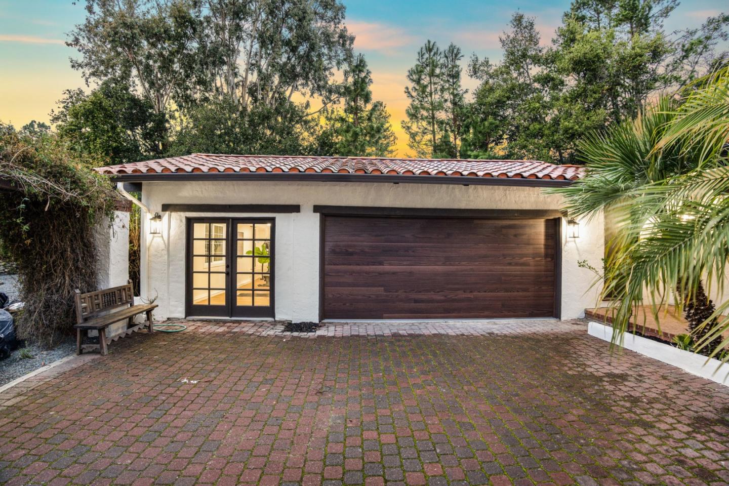 26645 Altamont Road Los Altos Hills, CA 94022 - Photo 4 of 60 a front view of a house with a yard and garage