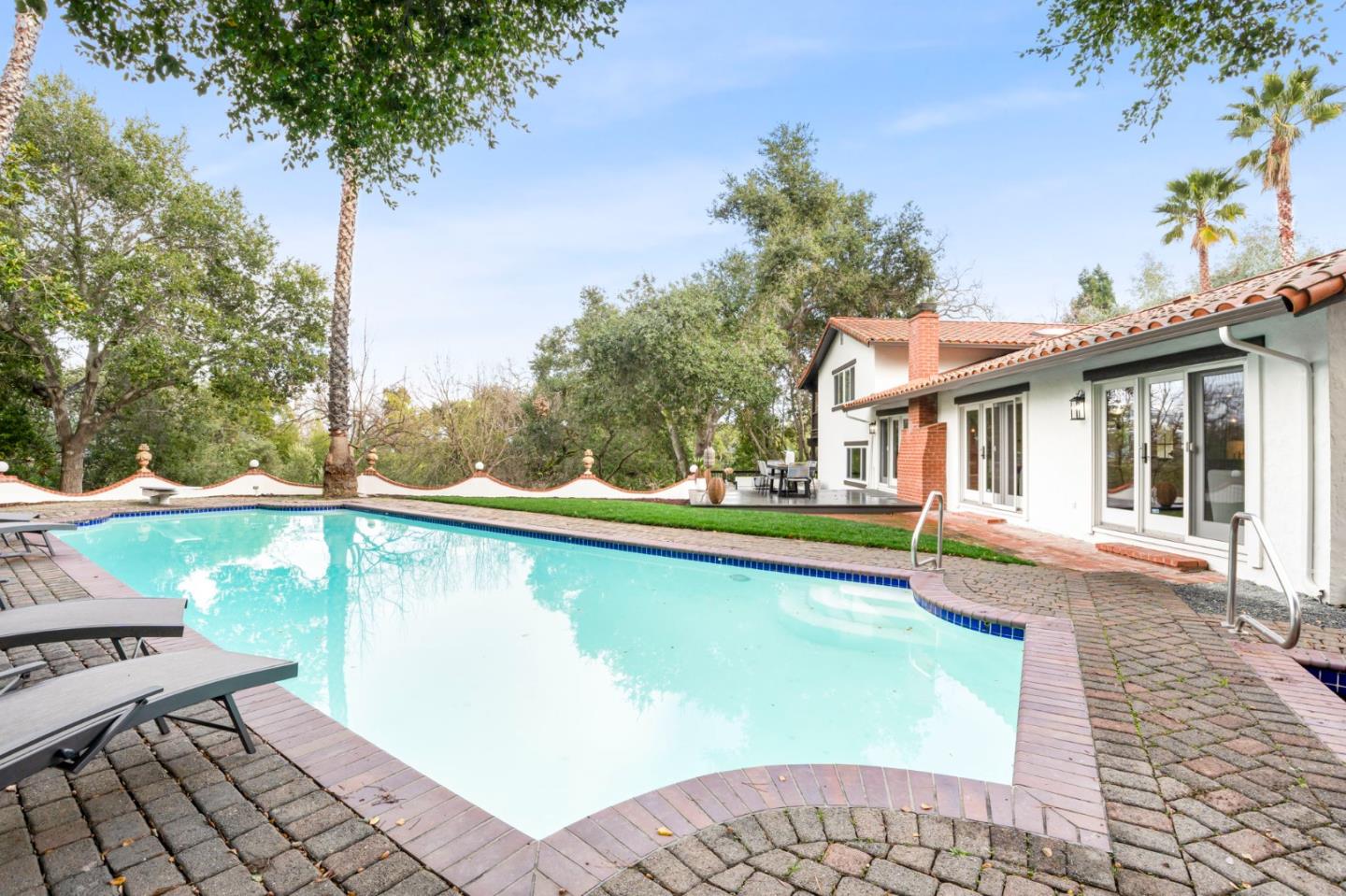 26645 Altamont Road Los Altos Hills, CA 94022 - Photo 49 of 60 a view of a house with pool plants and large tree